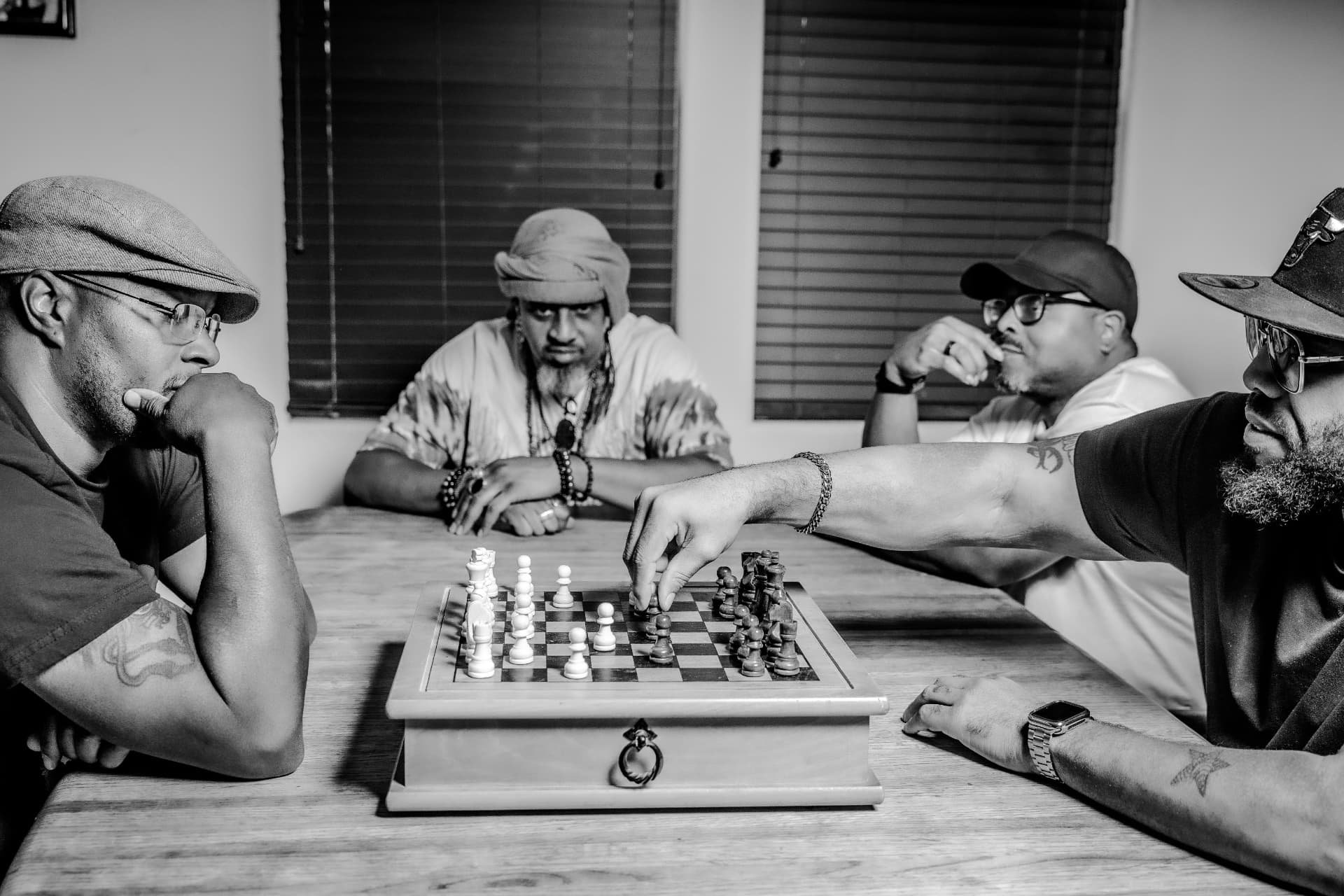 Black-and-white photograph of a chess match between friends